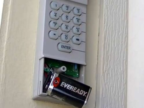how to change battery in garage door opener keypad