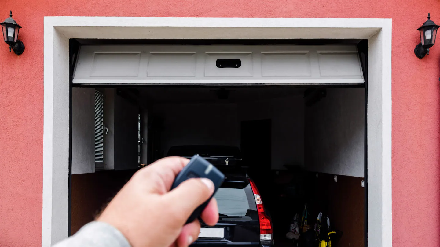 man-opening-garage-door-remote